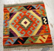 A vegetable dye wool Choli Kilim mat, 50 x 50cms