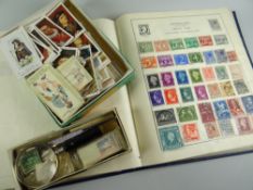 A blue Strand stamp album with near completed contents & a quantity of cigarette cards