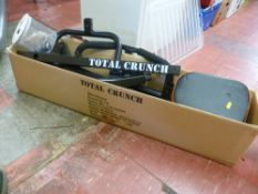 Boxed Total Crunch exercise machine