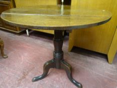 Tilt top circular tripod table