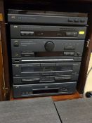 Inlaid cabinet containing a JVC hifi stereo and speakers E/T