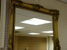 Ornate gilt framed wall mirror, 80 x 57 cms