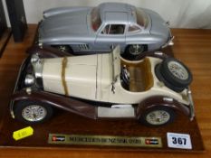 Two Burago model vehicles on plinths, both Mercedes Benz