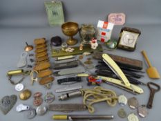 Box of collectables including cut throat razors, pocket knives, vintage whistles, copper health