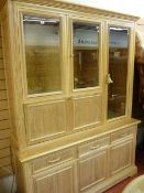 Excellent limed oak display cabinet with bevelled glass upper doors by Wade Furniture