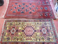 Red rug, approx 140 x 90 cms and a multicoloured rug, 125 x 69 cms