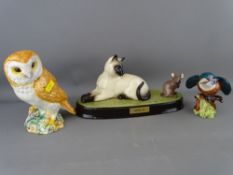Three Beswick ceramic models - Siamese cat and mouse on a plinth titled 'Watch It', a kingfisher and