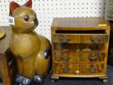 Apprentice veneered chest of drawers and a treen cat