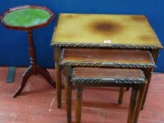 Polished wood nest of three tables and a small leather tooled top tripod wine table