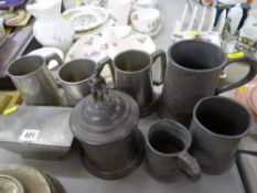 Beaten pewter lidded box, pewter tankards and a pewter tea caddy