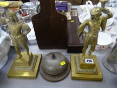 Pair of heavy brass figures and an old brass desk bell