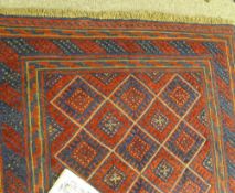 Cazak rug, red and blue ground block diamond pattern with multiple bordered edge, 120 x 115.5 cms