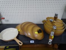 Set of five Le Creuset saucepans with lids and a Le Creuset frying pan