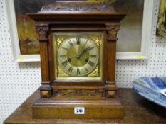 Carved front brass faced bracket clock