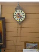 French style ornate wall clock with weights and pendulum