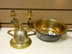 Iron handled brass pan, pair of serpent brass candleholders and a brass tabletop bell