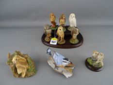 Royal Doulton set of six owl figurines on a wooden stand with three further figures by Country