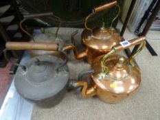 Four antique copper kettles