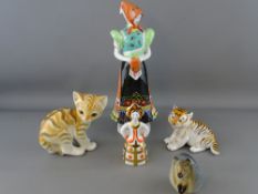 Group of collectables figures including a 'Hollohaza' Hungarian lady in traditional dress, three