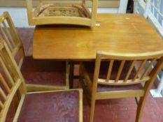 Twin flap gate leg table by Timeless Trend Furniture and four Ercol? light wood chairs