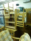 Modern light wood drop leaf dining table and four chairs together with a four shelf bookcase