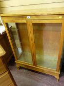 Modern light wood glazed two door display cabinet