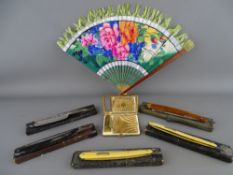 Five cut throat razors, a decorative fan and a yellow metal powder compact and lipstick holder