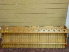 Pine two shelf wall hanging rack with heart shaped carvings
