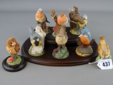 Royal Worcester china figurine of a wren no. 3198, a Country Artists matt finish little owl and a