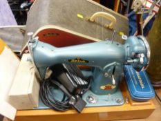 Cased Delso electric sewing machine and accessories E/T
