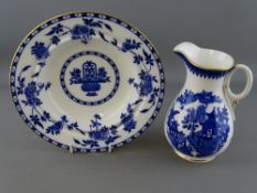 Royal Worcester blue Willow narrow necked jug and a Minton circular Delft patterned dish