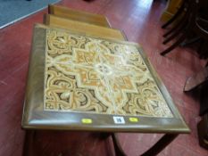 Mid Century nest of three tables, the largest table having a tiled top