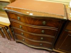 Serpentine front four drawer chest with inlay