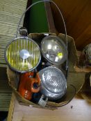 Three vintage car headlamps and other garage items