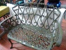 Small metal ornate garden bench
