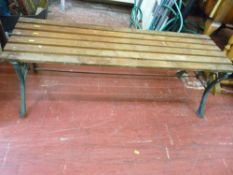 Wooden slatted garden bench with metal supports (no back)