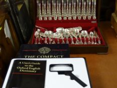 Comprehensive edition of 'The Compact Oxford Dictionary' with guide and magnifying glass and an