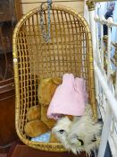 Hanging bamboo basket seat and contents of large soft toy, waffle blanket and rug