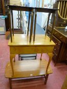 Modern coffee table with slatted undershelf, light wood box with lift-up lid on tapered supports and