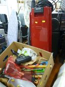 Red upright vacuum cleaner and a box of small hand tools E/T