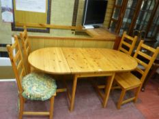 Twin flap gate leg pine dining table with four chairs
