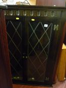 Two door lead glazed corner cupboard