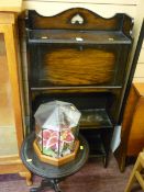 Compact slim two shelf bookcase with drop down bureau, a small black tripod wine table and a glass