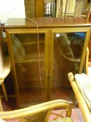 Modern glazed two door display cabinet