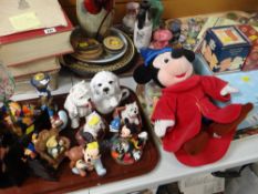 A parcel of Disney items, boxed ornaments, Peter Rabbit items & a quantity of souvenir pottery ETC