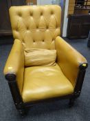 A William IV buttoned backed and studded library chair in mustard leather