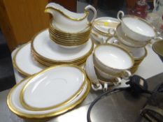 A quantity of Royal Tuscan fine bone china dinnerware for Harrods with Grecian key & gilded border