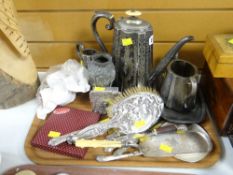 A parcel of metalware including silver backed brushes, silver mounted flatware, EPNS, napkin rings