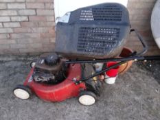A Laser by Mountfield petrol lawn mower together with a selection of garden pots (outside) Condition
