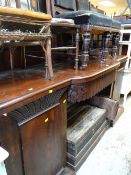 A large mahogany breakfront pedestal sideboard with carved rail back, 222cms wide Condition